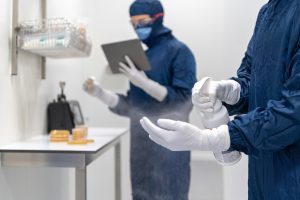 Sola professional cleaning experts in protective gear testing surfaces and sanitizing solutions to debunk common cleaning myths.
